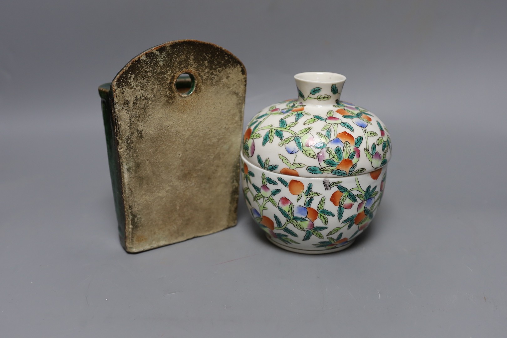 A Chinese famille rose chupu and cover and a Chinese green glazed wall vase, 18 cms high.